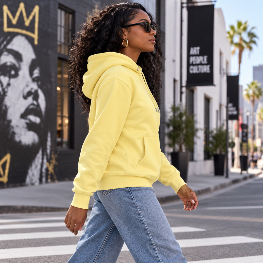 HEAD HELD HIGH bold yellow hoodie — arts district side view